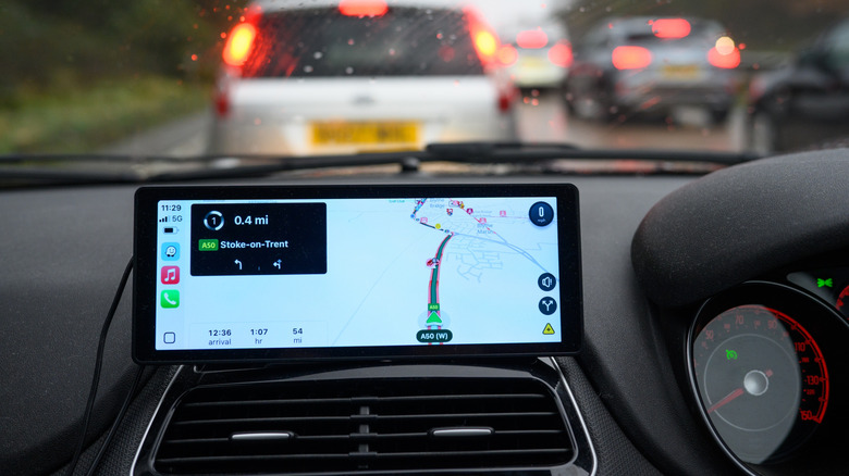 A car in a traffic jam showing navigation on CarPlay.
