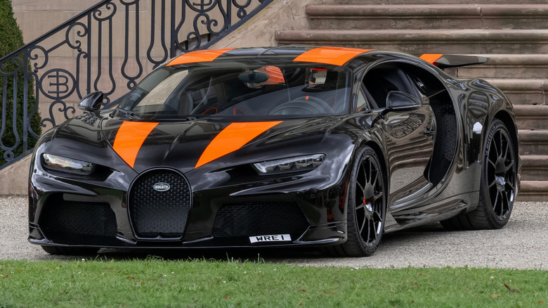 A two-tone Bugatti Chiron Super Sport parked in front of the Bugatti home in France.