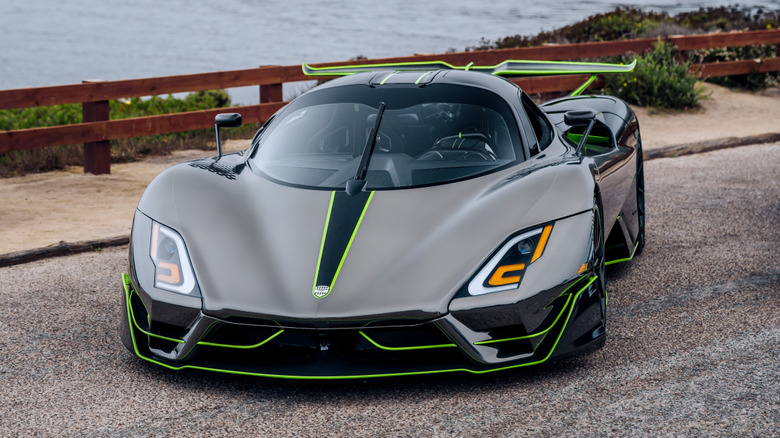 An SSC Tuatara hypercarked parked near the ocean.