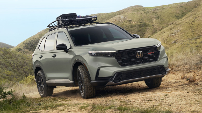 green Honda CR-V TrailSport off-roading