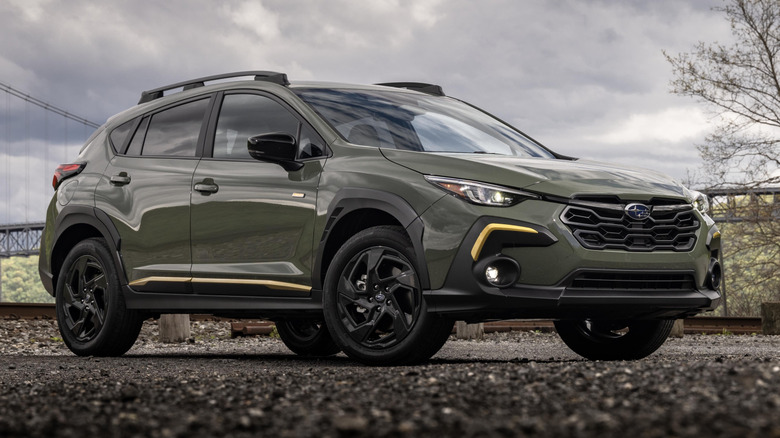 forest green Subaru Crosstrek Sport on a gravel road