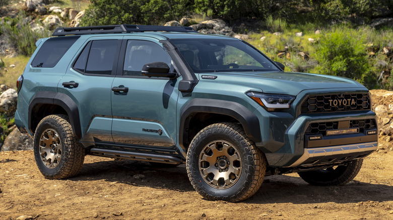 green Toyota 4Runner parked on a dirt road