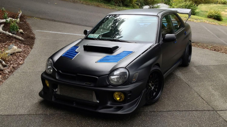 Matte black vinyl wrap on car
