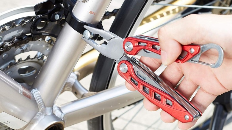 Amazon Basics 8-in-1 Stainless Steel Multitool being used on a bike
