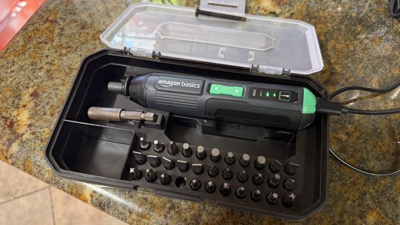 Amazon Basics Rechargeable Cordless Stick Screwdriver being charged in case