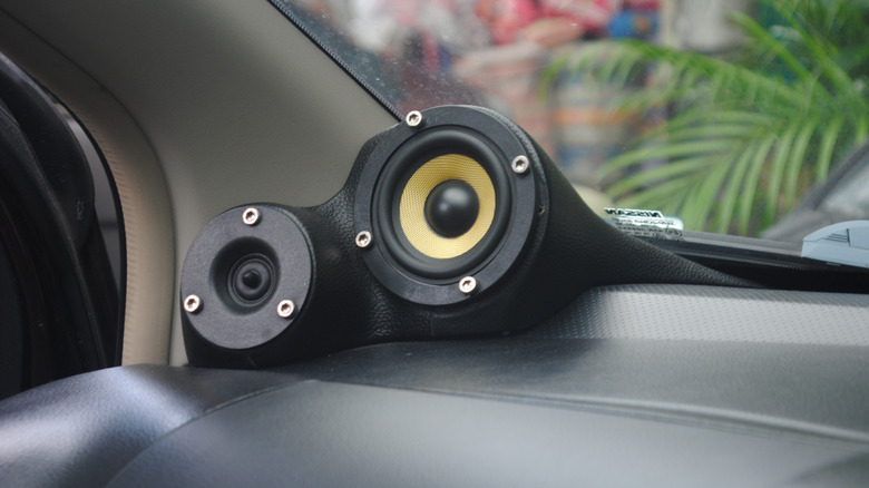 Fitted car speaker in windshield corner