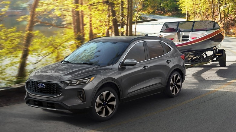 2025 Ford Escape in gray towing a boat