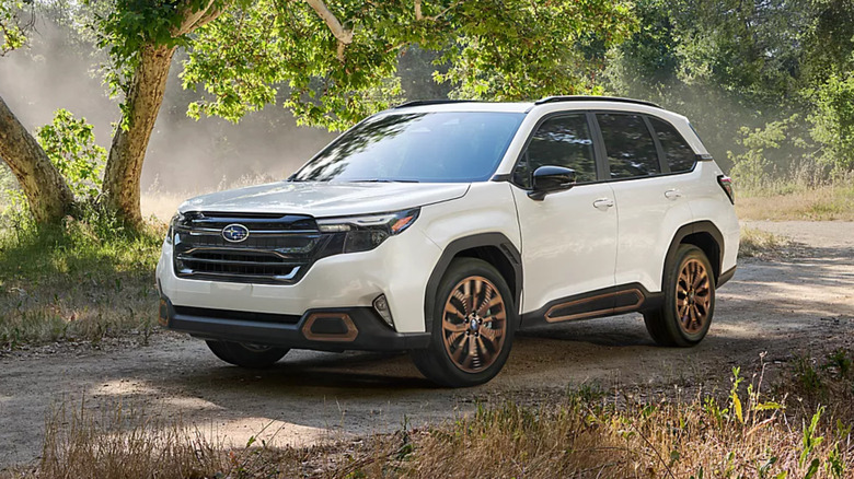 2025 Subaru Forester in white travelling through a gravel road