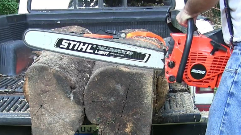 Wood being cut with an Echo CS-680 using a Stihl bar.
