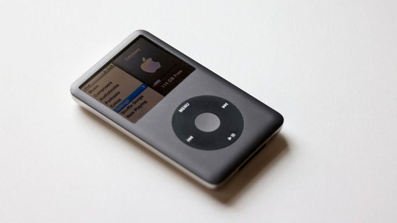 An iPod on a white surface.