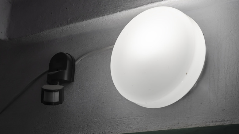 Emergency light and motion sensor. Indoor emergency light and wall mounted motion sensor.