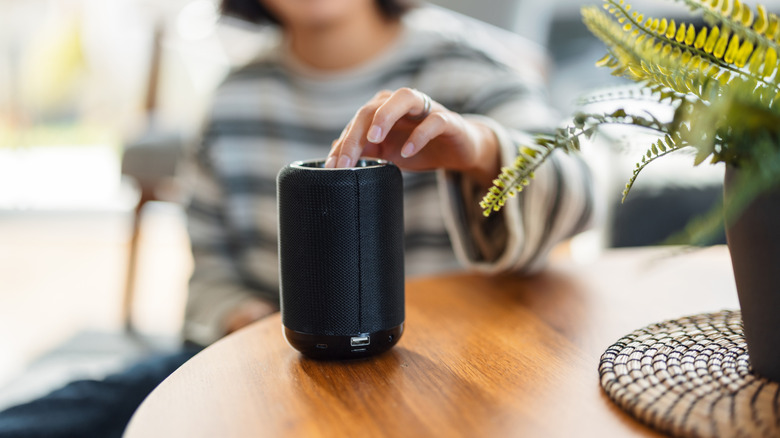 A Bluetooth speaker being switched on.