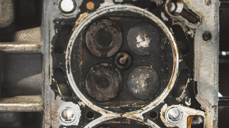 an old engine that's covered in carbon deposits