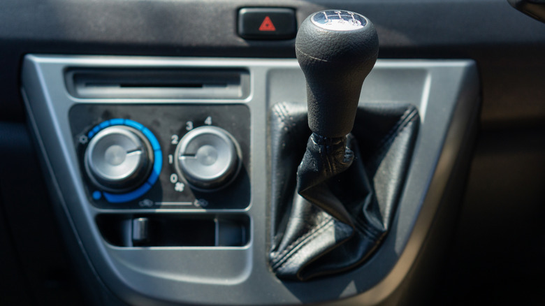 Close up of a manual car's gear shifter.