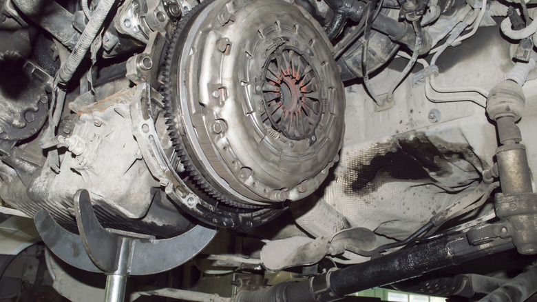 Close up of the underside of a vehicle, worn components clearly visible