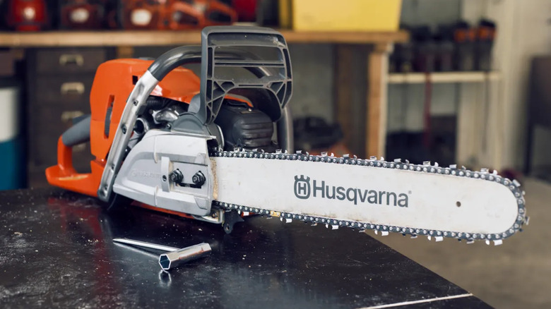 A Husqvarna chainsaw on a workbench