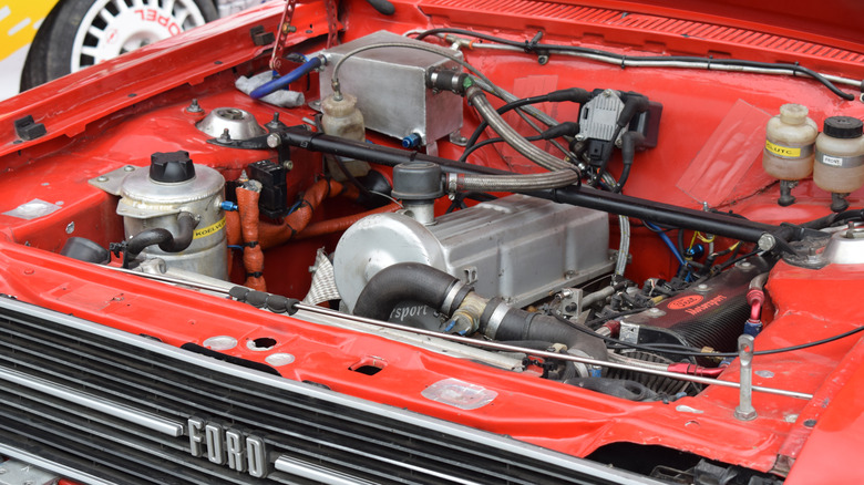 A close-up of an old Ford Escort engine.