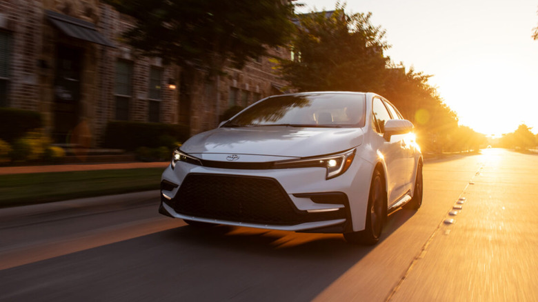 A 2026 Toyota Corolla on a road at sunset