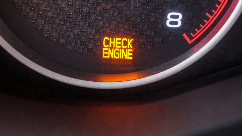 Glowing check engine signal indicating some sort of engine trouble.