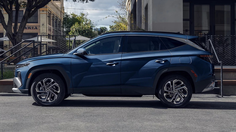 A blue 2026 Hyundai Tucson parked on a city street