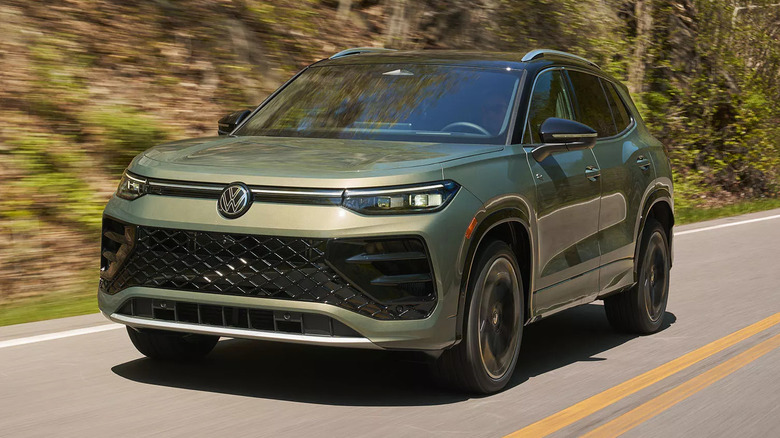 A green 2027 Tiguan SEL R-Line Turbo on a rural road