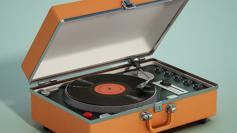 A turntable inside an orange briefcase