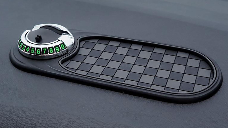 An anti-slip mat on the dashboard of a car.