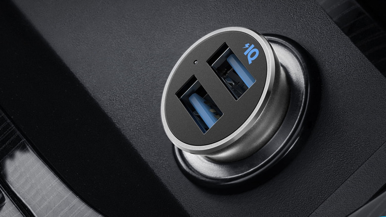 An Anker USB charger inside a car.