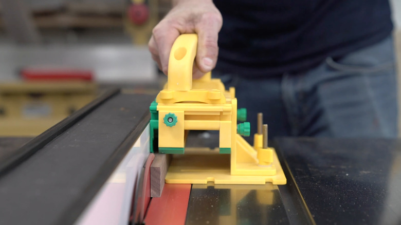 A person using a GRR-Ripper tool with a thin rip attachment.