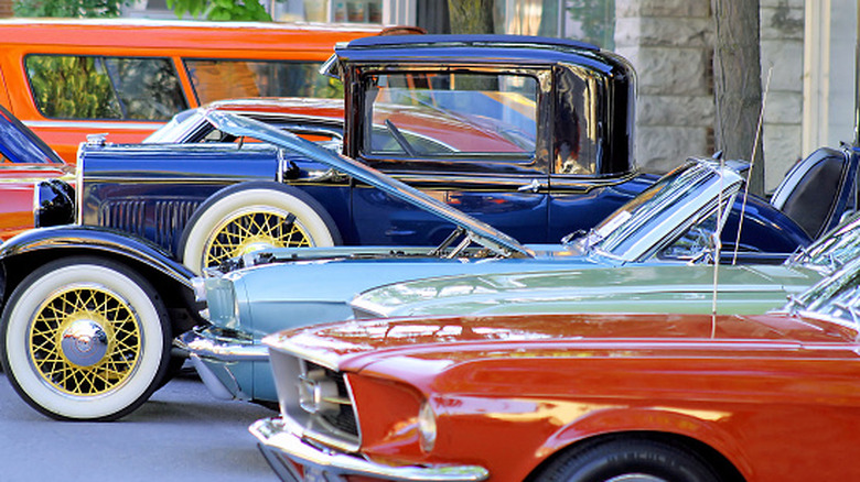 Several classic colors in various colors parked in a line together