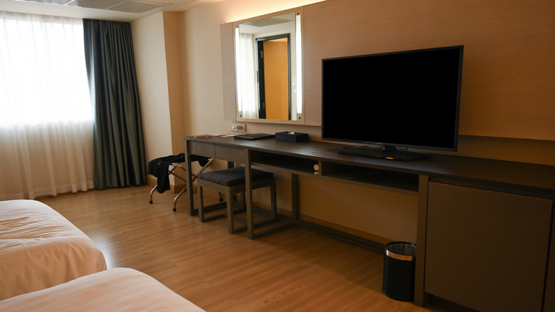 Hotel room with TV and two beds