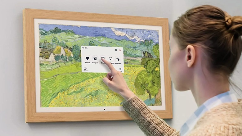 A person using a wall-mounted Aeezo frame.