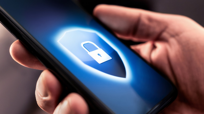 Close-up of phone screen with lock symbol representing data security concept.