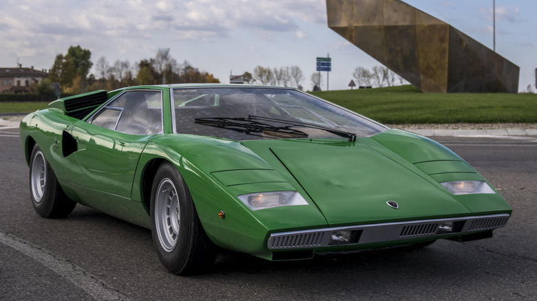 Front 3/4 view of Lamborghini Countach parked on road