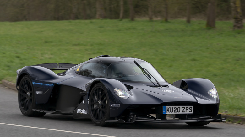 Front 3/4 view of Aston Martin Valkyrie driving on public road