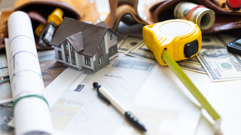 Documents and various tools on a table.
