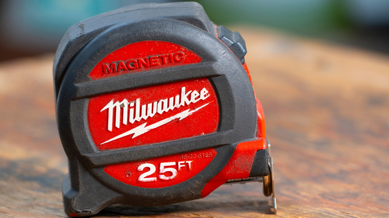 Milwaukee tape measurer on a workbench