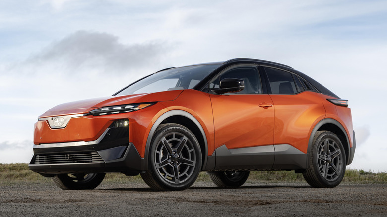 A bright orange 2026 Subaru Uncharted parked on gravel