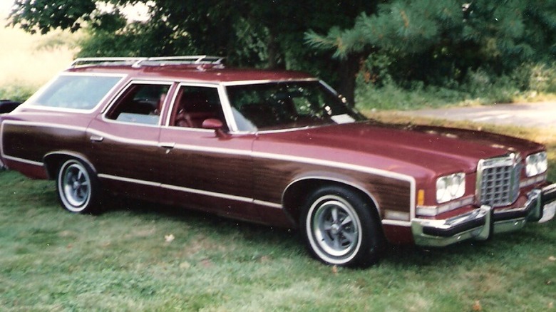 Plum 1974 Pontiac Safari wagon parked in grass
