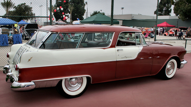 Two-tone Sky Chief 2-door station wagon parked outdoors at car show