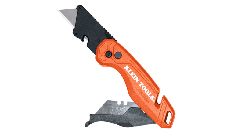 Klein Tools "Flickblade" folding utility knife partially opened against white background