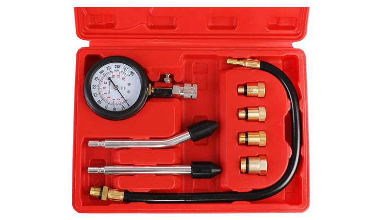 Compression tester tool in a case on a plain background