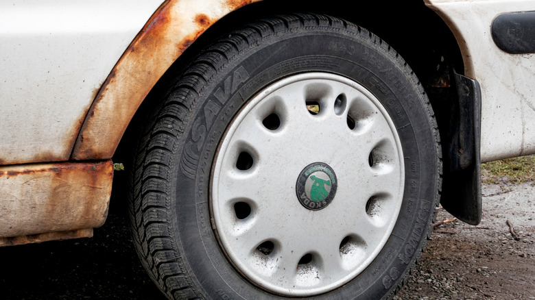 Sava tire on rusted car