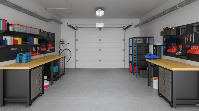 Picture of the inside of a garage with simmetrical work stations on the left and right sides.