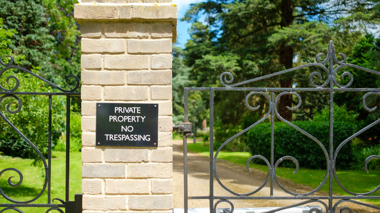 Entrance to gated community with private property sign.