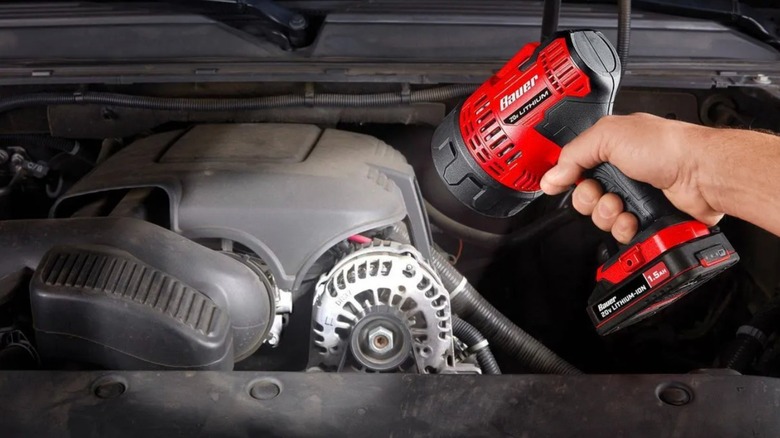 20V Cordless 2,500-lumen Spotlight shining on car engine