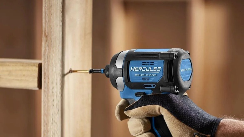 Using the Hercules impact driver to install screws in wood framing.