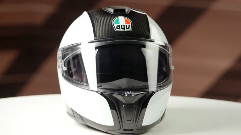 An AGV motorcycle helmet advertised on RevZilla's YouTube channel.