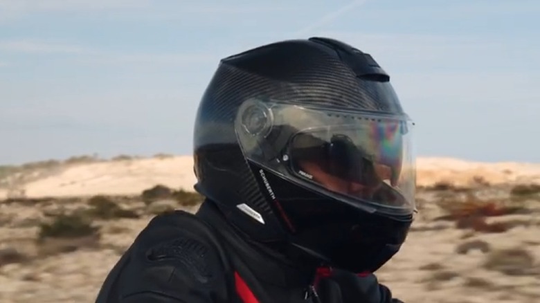 A rider wearing a Schuberth Carbon helmet for a promotional video presented by Schuberth.