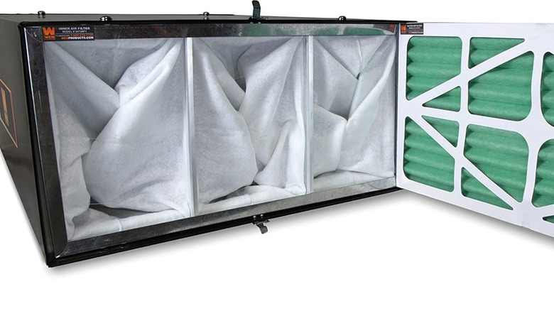 An opened Wen remote-controlled air filtration system, revealing its filter